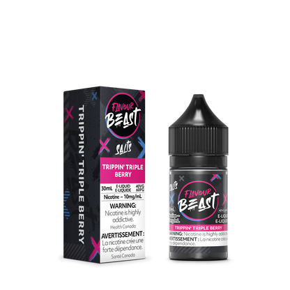 Flavour Beast Trippin' Triple Berry with fresh strawberries, raspberries, and blueberries, highlighting its juicy, fruity taste.