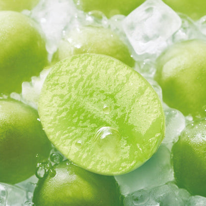 RELX POD PRO 2 Green Grape Ice pods placed with fresh green grapes and icy elements, showcasing their crisp and sweet essence.